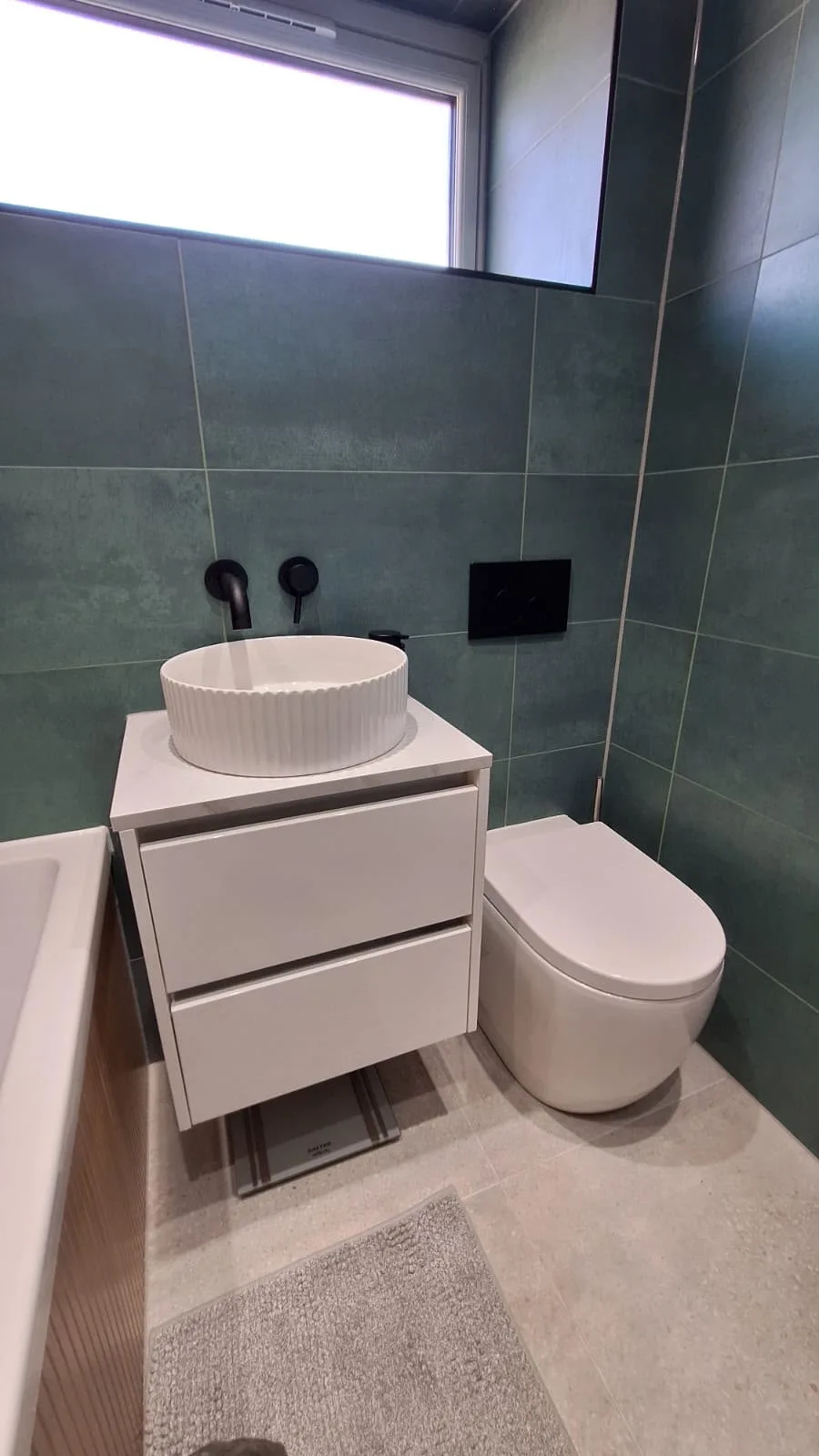 Green-tile bathroom from Doherty Plumbing and Gas work gallery